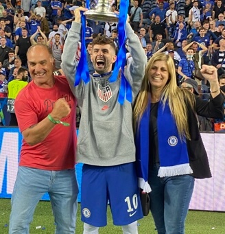 Christian Pulisic with his parents, Mark Pulisic and Kelley Pulisic.